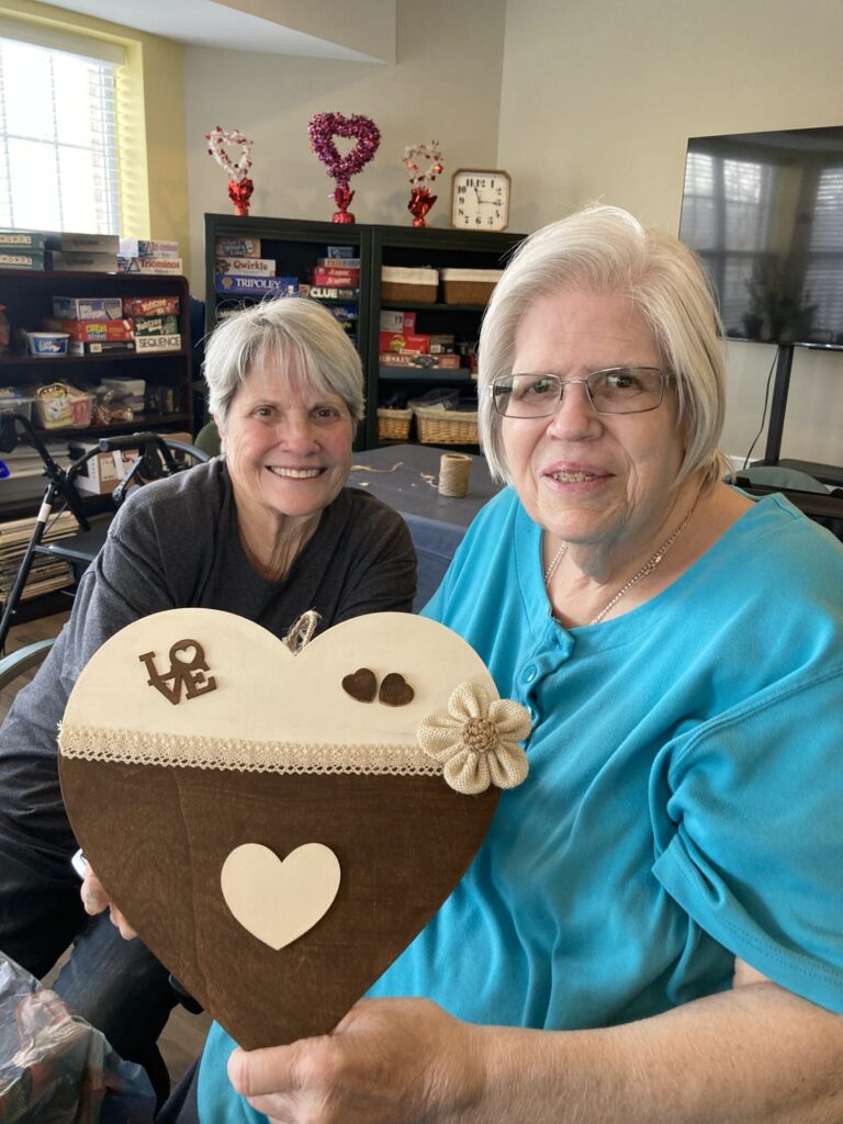 A couple of residents participating in a craft class