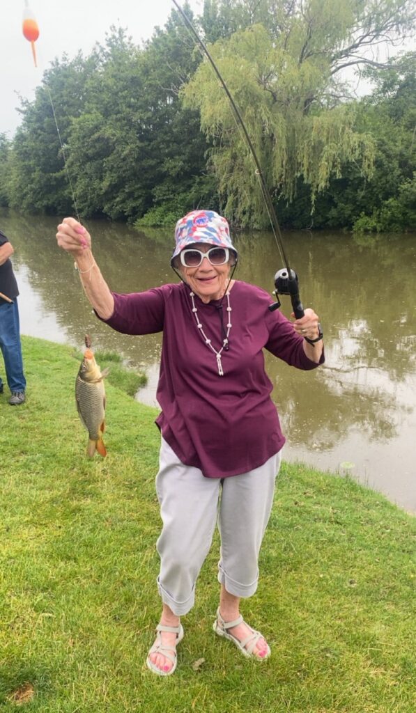 A woman fishing in the pond